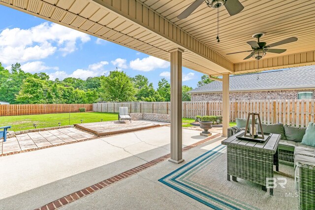 view of patio with ceiling fan and an outdoor living space