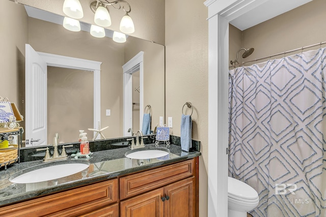 bathroom featuring toilet, vanity, and a shower with shower curtain