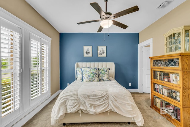 carpeted bedroom with ceiling fan