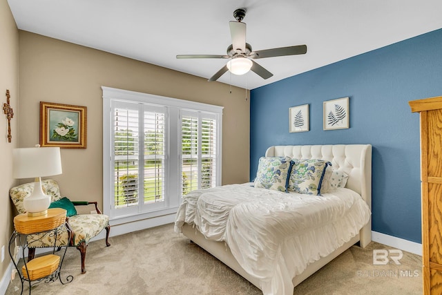 carpeted bedroom with ceiling fan