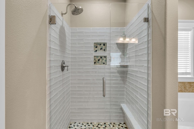 bathroom featuring an enclosed shower