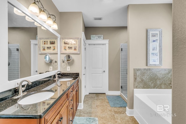 bathroom with independent shower and bath, tile patterned floors, and vanity