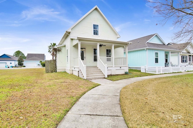 bungalow-style home featuring covered porch and a front lawn