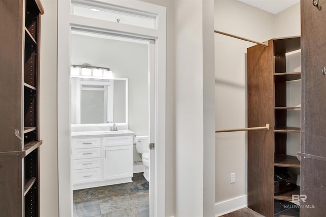 walk in closet with sink