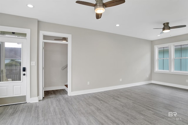 interior space featuring ceiling fan and light wood-type flooring