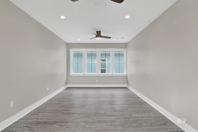 unfurnished room with ceiling fan and wood-type flooring