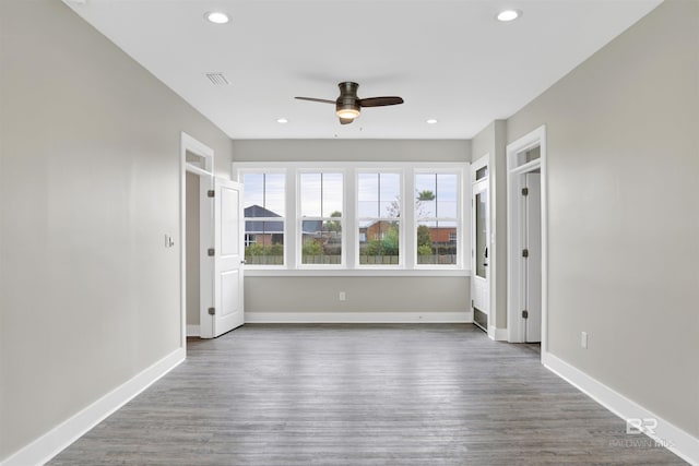 spare room featuring ceiling fan and wood-type flooring