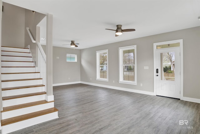 entryway with ceiling fan and hardwood / wood-style flooring