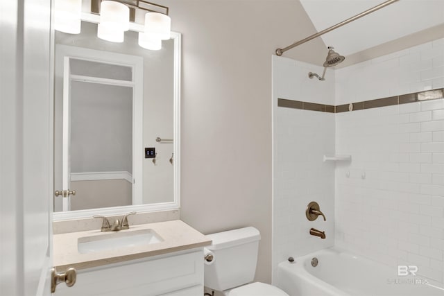 full bathroom with toilet, tiled shower / bath combo, and vanity