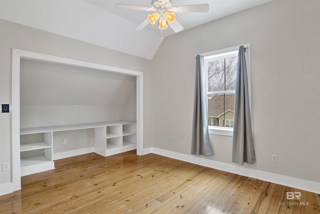 bonus room with lofted ceiling, ceiling fan, and hardwood / wood-style flooring