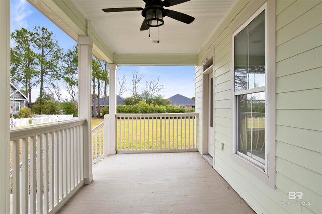 balcony with ceiling fan and covered porch