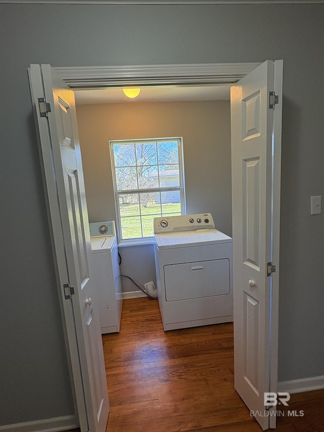 laundry area featuring independent washer and dryer and dark hardwood / wood-style floors