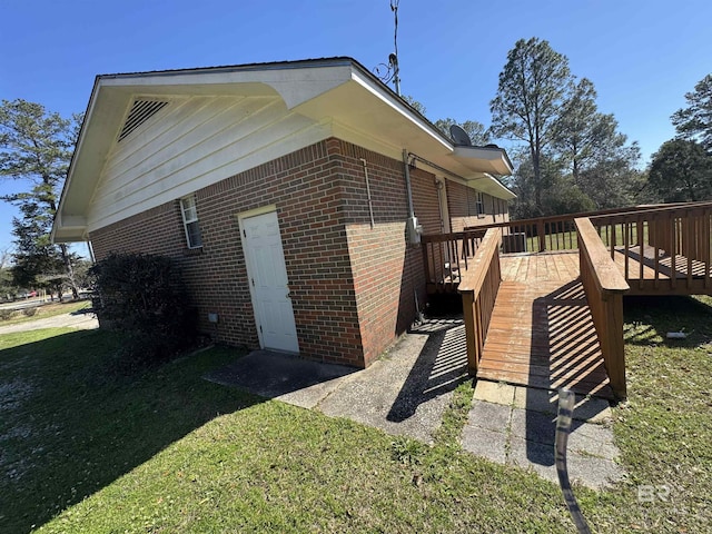 view of home's exterior with central AC, a yard, and a deck