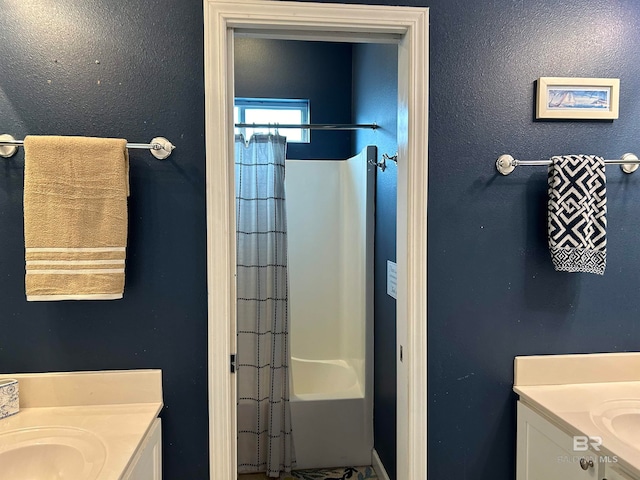 bathroom featuring vanity and shower / bath combo with shower curtain