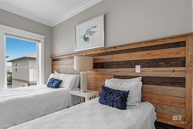 bedroom featuring crown molding