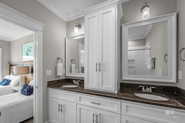 bathroom featuring double vanity, ensuite bath, ornamental molding, and a sink