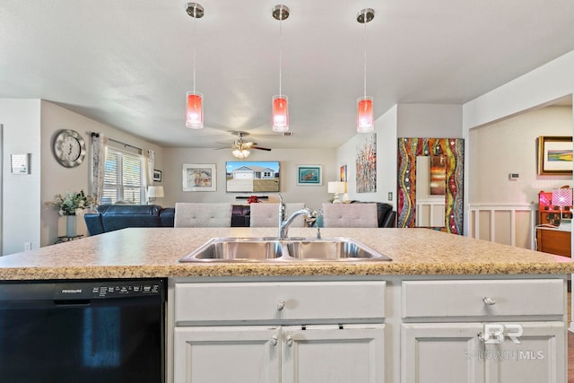 kitchen featuring black dishwasher, white cabinetry, ceiling fan, and sink