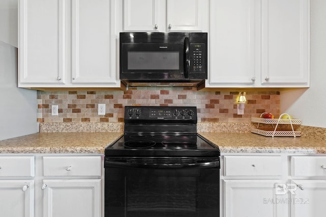 kitchen with white cabinets, decorative backsplash, and black appliances