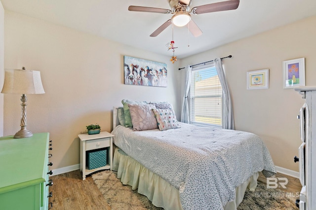 bedroom with ceiling fan and light hardwood / wood-style flooring