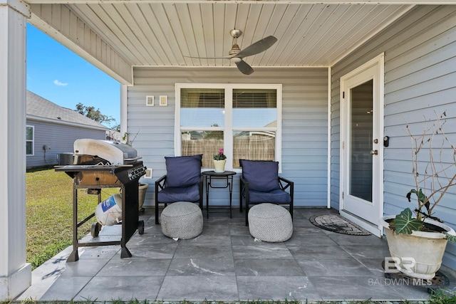 view of patio featuring area for grilling and ceiling fan