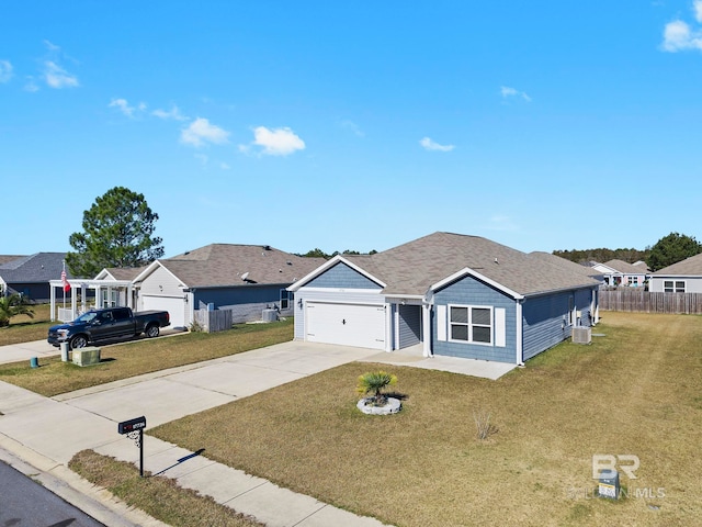 single story home featuring a garage and a front yard