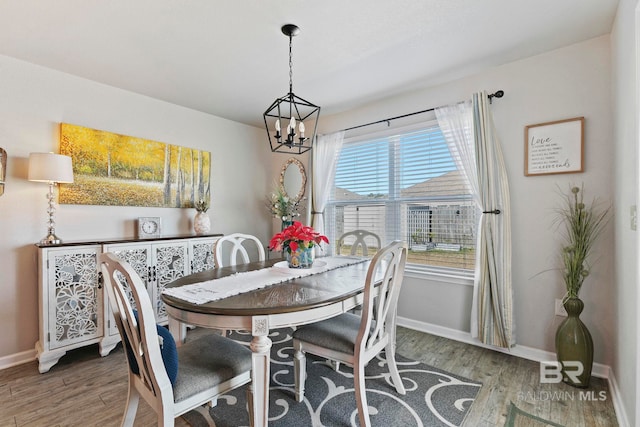 dining space featuring a chandelier and hardwood / wood-style floors