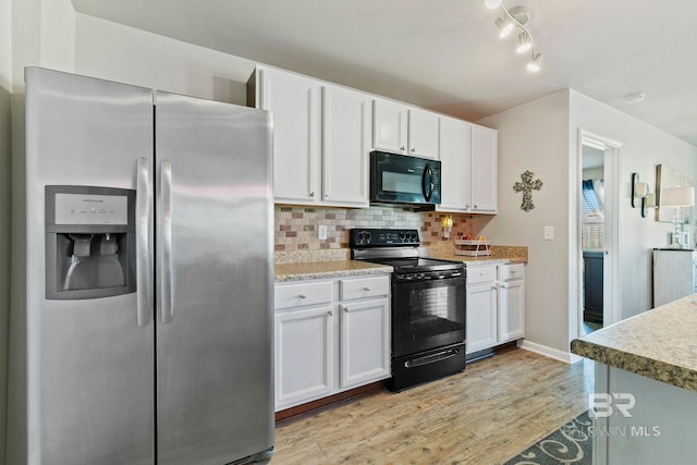 kitchen featuring white cabinets, decorative backsplash, light hardwood / wood-style floors, and black appliances