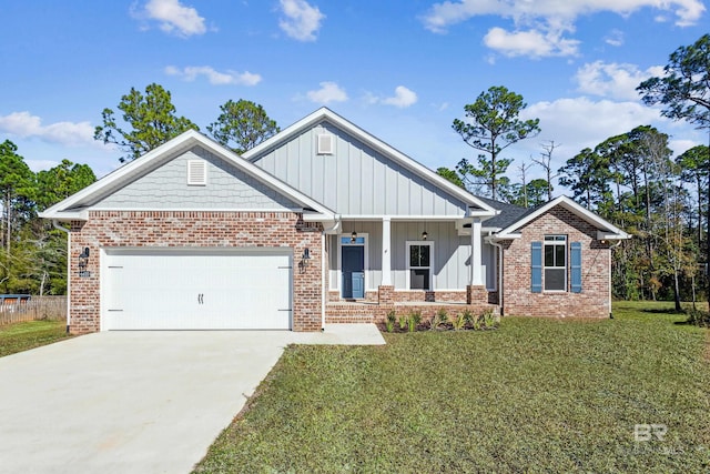 craftsman-style house featuring a garage, a front yard, and covered porch