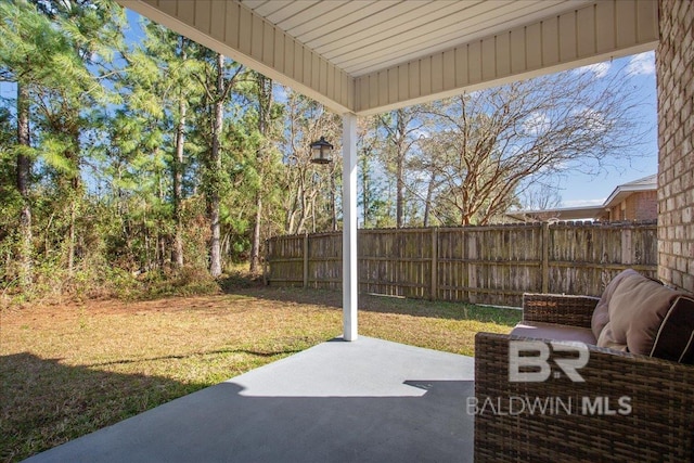 view of patio / terrace featuring fence