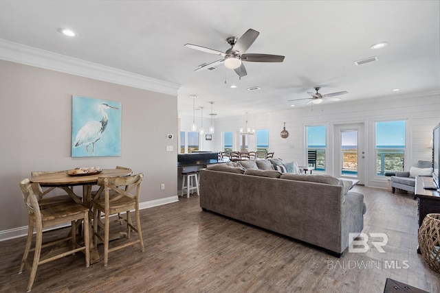 1402 W Dune Dr, Gulf Shores, AL 36542 - living area with recessed lighting, visible vents, ornamental molding, baseboards, and ceiling fan with notable chandelier