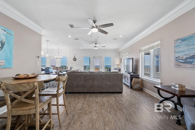 1402 W Dune Dr, Gulf Shores, AL 36542 - living room featuring visible vents, recessed lighting, ceiling fan with notable chandelier, wood finished floors, and ornamental molding