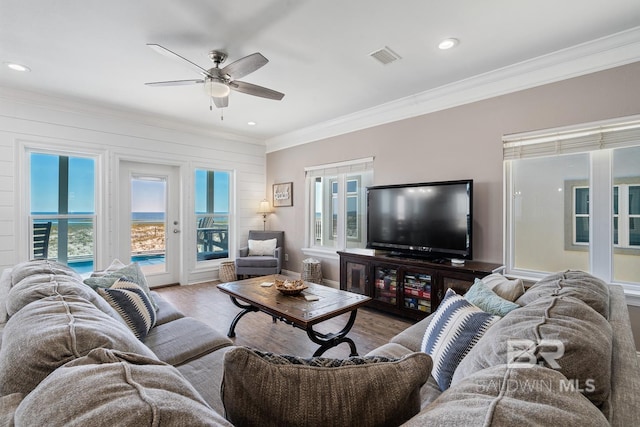 1402 W Dune Dr, Gulf Shores, AL 36542 - living area with a ceiling fan, wood finished floors, ornamental molding, visible vents, and recessed lighting