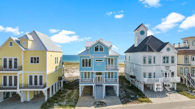 1402 W Dune Dr, Gulf Shores, AL 36542 - view of front facade with a carport, driveway, french doors, and a balcony