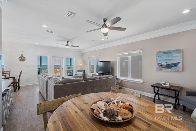 1402 W Dune Dr, Gulf Shores, AL 36542 - interior space with wood finished floors, visible vents, ceiling fan, and ornamental molding
