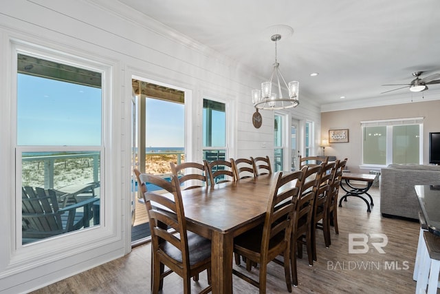 1402 W Dune Dr, Gulf Shores, AL 36542 - dining room featuring recessed lighting, ornamental molding, wood finished floors, and ceiling fan with notable chandelier