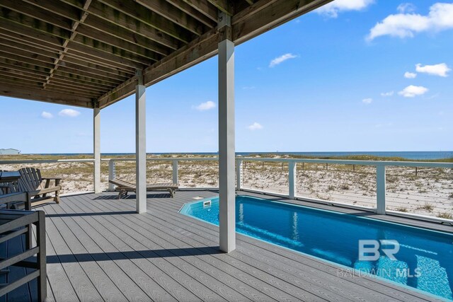 1402 W Dune Dr, Gulf Shores, AL 36542 - wooden deck with a view of the beach, a water view, and a swimming pool