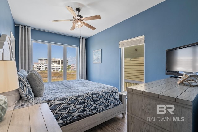 1402 W Dune Dr, Gulf Shores, AL 36542 - bedroom featuring wood finished floors and ceiling fan
