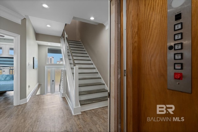 1402 W Dune Dr, Gulf Shores, AL 36542 - stairway with baseboards, wood finished floors, and recessed lighting