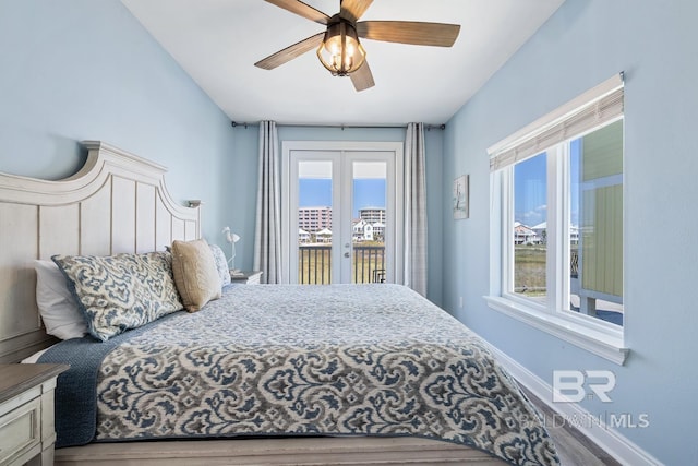 1402 W Dune Dr, Gulf Shores, AL 36542 - bedroom with baseboards, wood finished floors, ceiling fan, and access to exterior