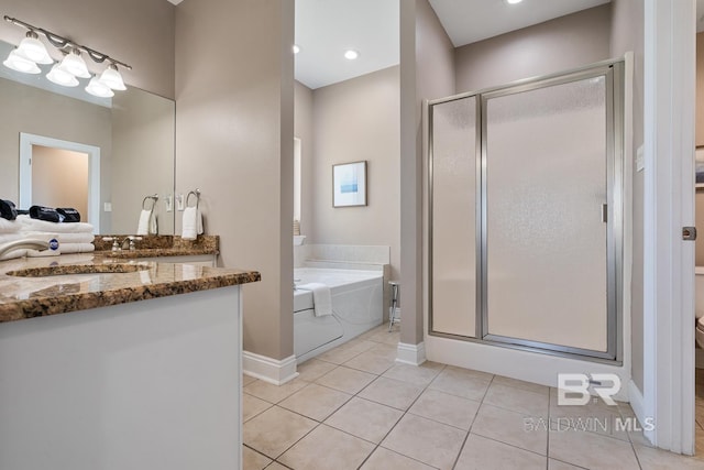 1402 W Dune Dr, Gulf Shores, AL 36542 - full bathroom with a garden tub, a stall shower, vanity, baseboards, and tile patterned flooring