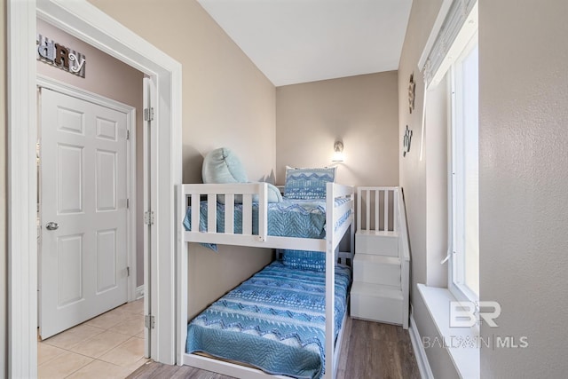 1402 W Dune Dr, Gulf Shores, AL 36542 - bedroom with tile patterned flooring