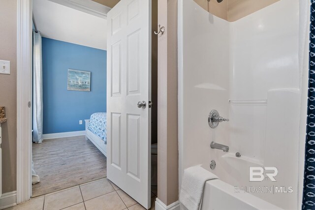 1402 W Dune Dr, Gulf Shores, AL 36542 - full bath featuring bathtub / shower combination, baseboards, and tile patterned flooring