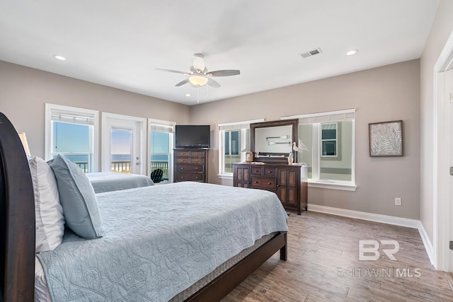 1402 W Dune Dr, Gulf Shores, AL 36542 - bedroom with recessed lighting, wood finished floors, access to exterior, visible vents, and baseboards
