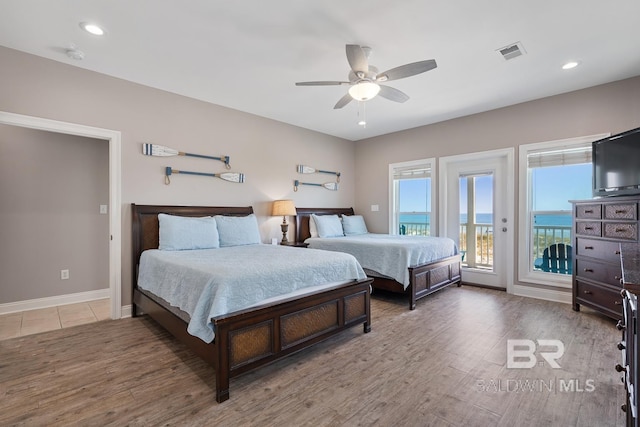 1402 W Dune Dr, Gulf Shores, AL 36542 - bedroom with wood finished floors, visible vents, baseboards, access to outside, and ceiling fan