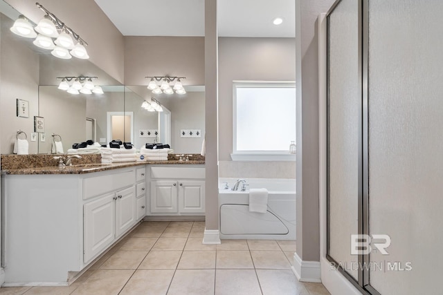 1402 W Dune Dr, Gulf Shores, AL 36542 - bathroom with tile patterned flooring, double vanity, a sink, a bath, and a stall shower