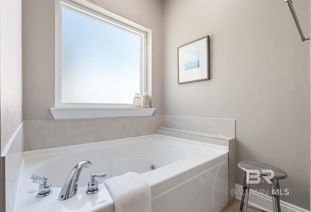 1402 W Dune Dr, Gulf Shores, AL 36542 - bathroom with a garden tub and plenty of natural light