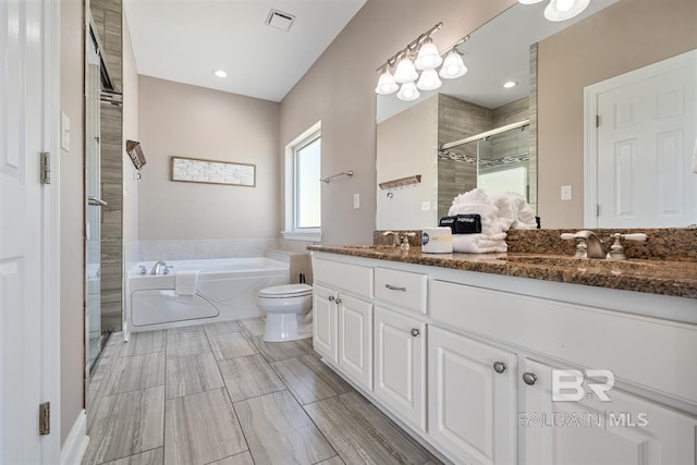 1402 W Dune Dr, Gulf Shores, AL 36542 - full bath featuring a stall shower, a bath, vanity, toilet, and visible vents