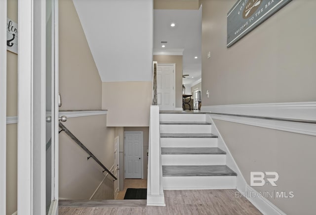 1402 W Dune Dr, Gulf Shores, AL 36542 - stairway featuring ornamental molding, wood finished floors, and recessed lighting