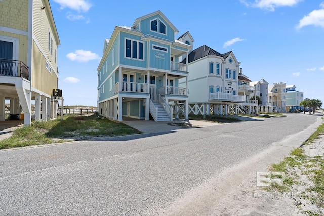 1402 W Dune Dr, Gulf Shores, AL 36542 - exterior space with stairway and a residential view