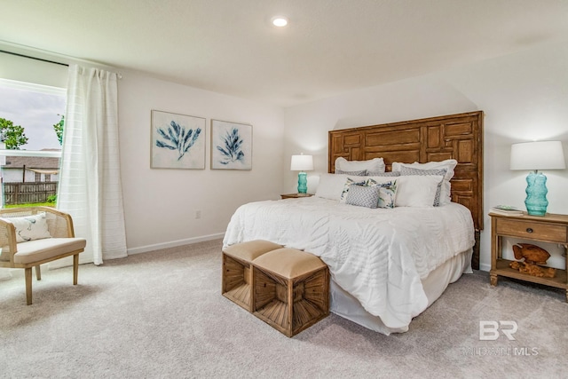 bedroom featuring recessed lighting, light carpet, and baseboards